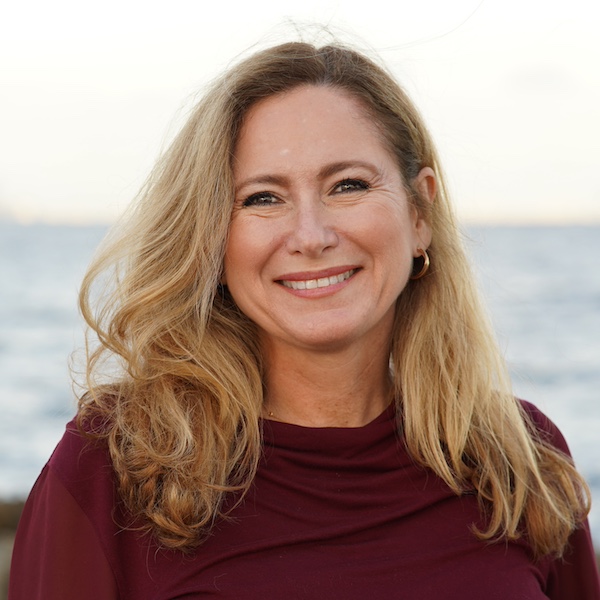 Debbie Mucarsel-Powell in front of blurred scenic water brackground